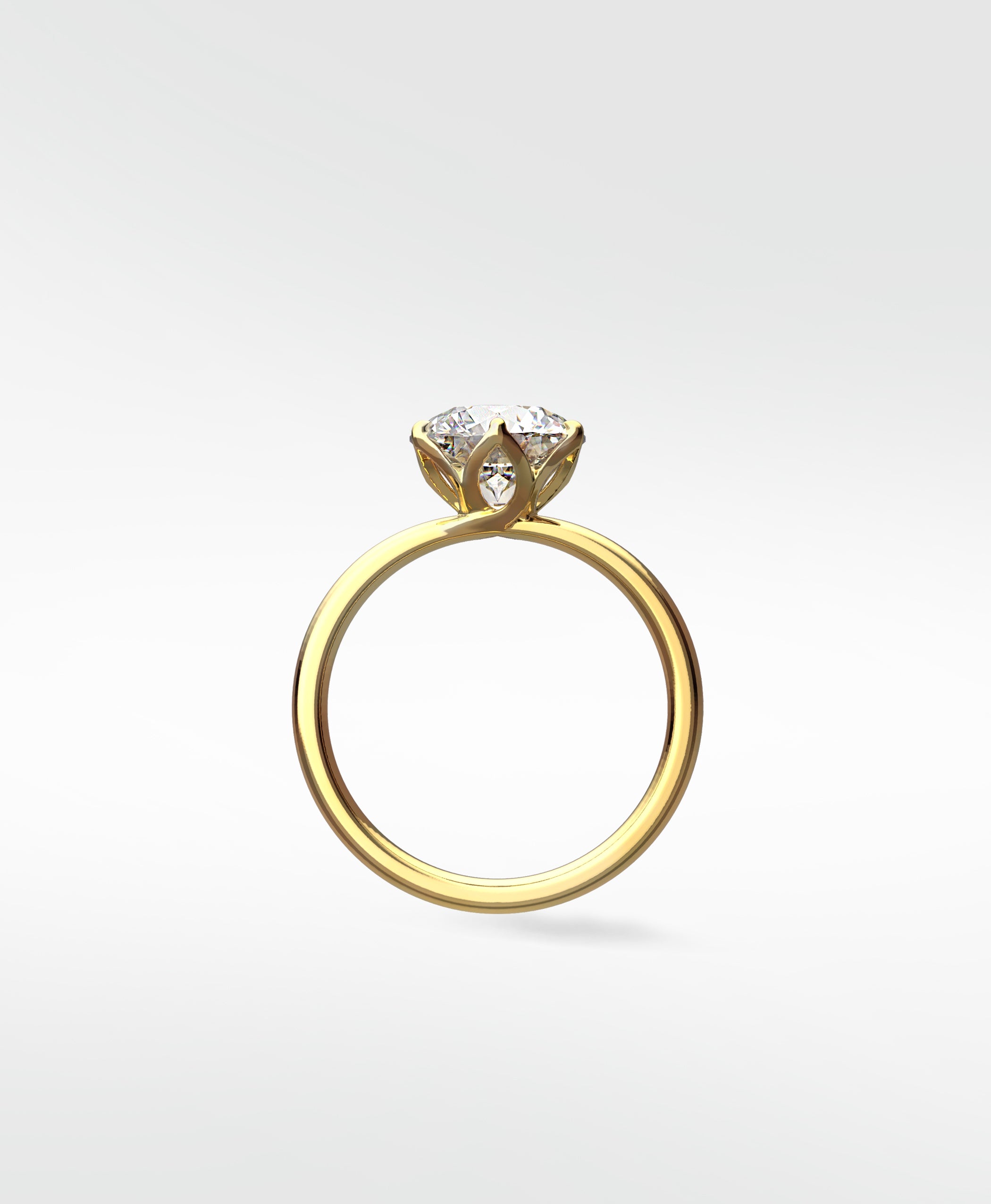 Side profile of the Lily Engagement Ring in yellow gold, showing the brilliant diamond held in a delicate petal claw setting.