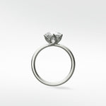 Lily Engagement Ring in white gold, shown in profile, with a solitaire diamond held in an elegant petal claw setting.