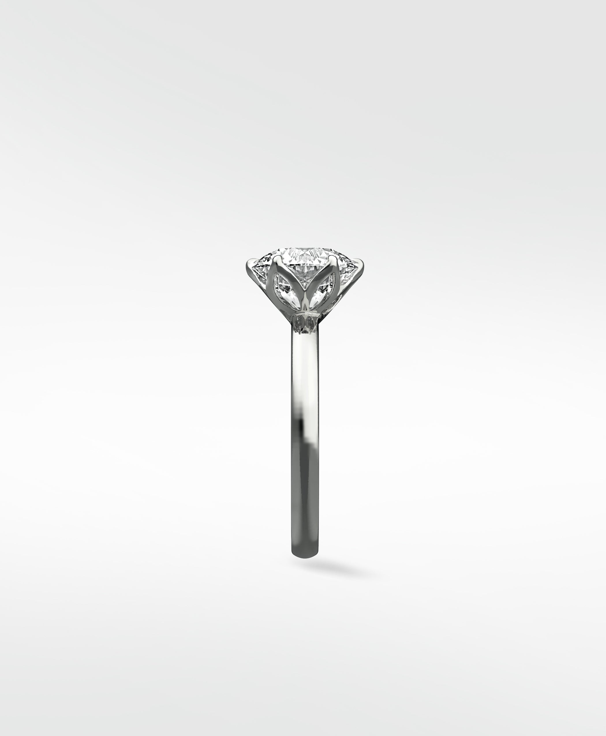 Side profile of the Lily Engagement Ring with a round diamond held in its signature petal claw setting.