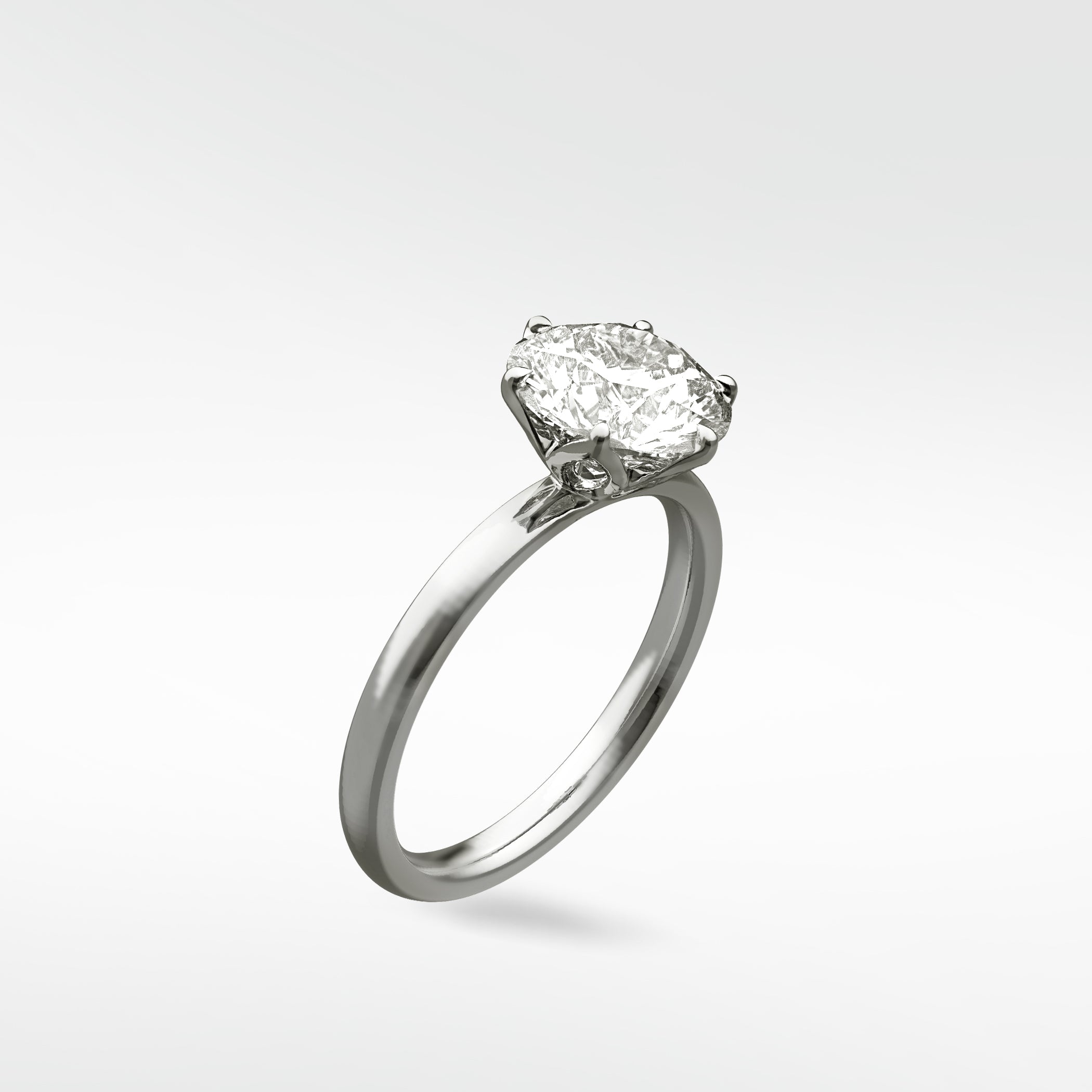 The Lily Engagement Ring featuring an oval diamond in a white gold petal claw setting, shown at an angle on a white background.