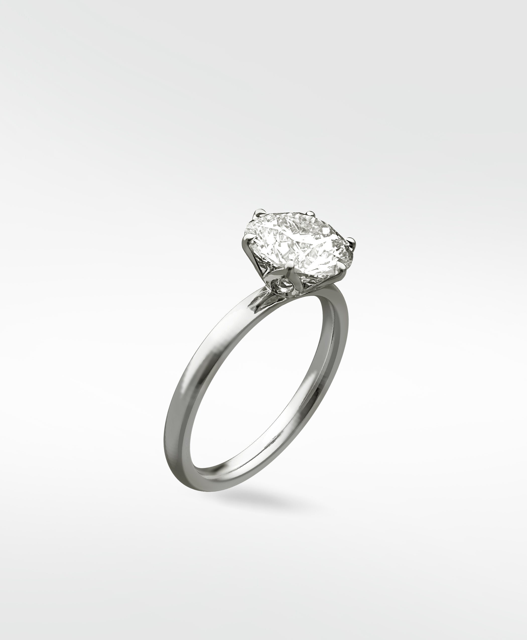 The Lily Engagement Ring featuring an oval diamond in a white gold petal claw setting, shown at an angle on a white background.