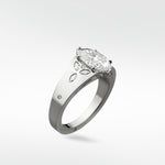 The Papaya Engagement Ring in platinum, featuring a large marquise-cut diamond and floral diamond accents on the band.
