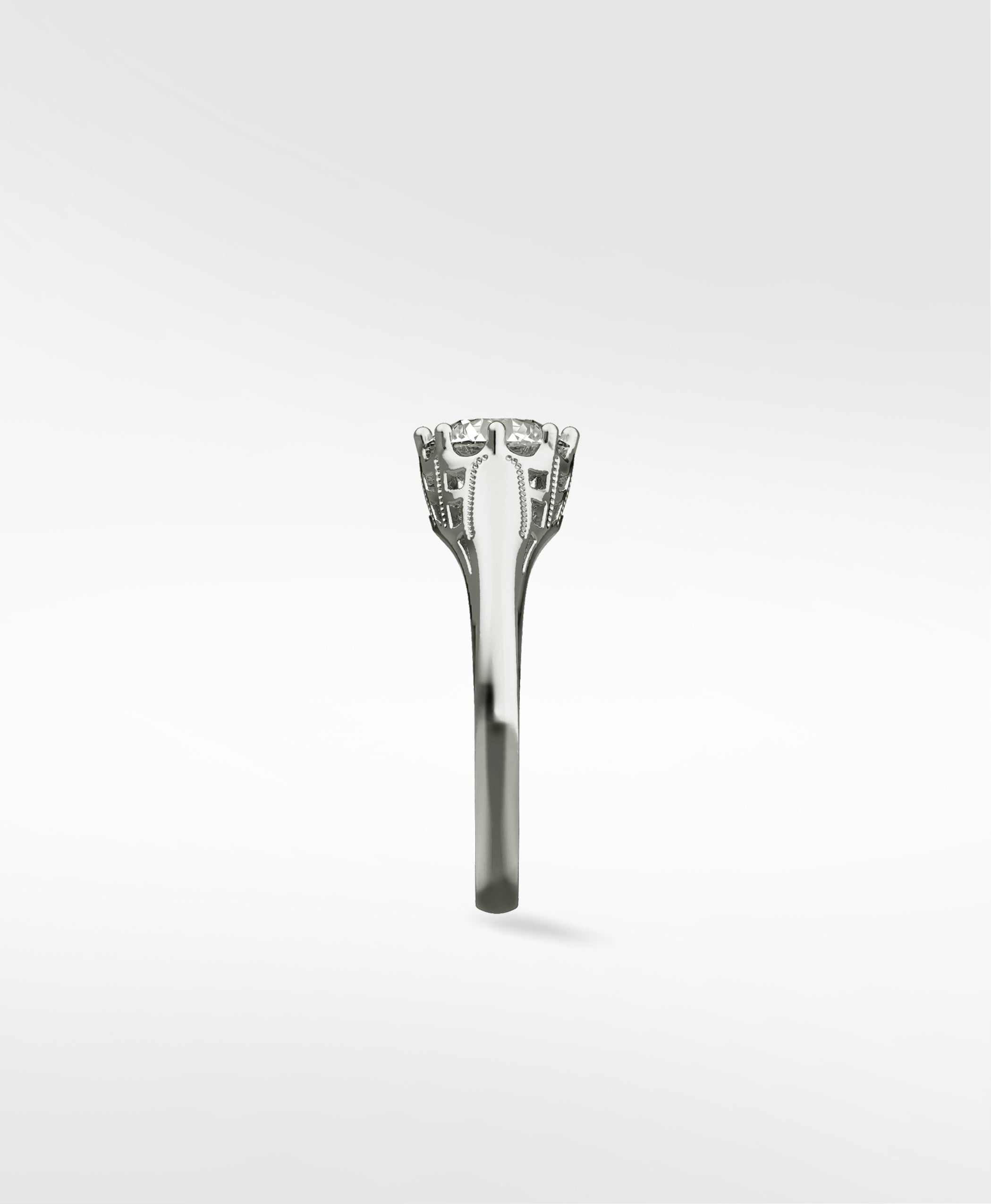 Side view of the vintage-style Mondo Engagement Ring, highlighting the intricate gallery setting holding a brilliant-cut diamond.