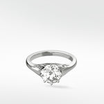 A vintage-style Mondo Engagement Ring in white gold, featuring a round brilliant diamond in a six-prong setting.