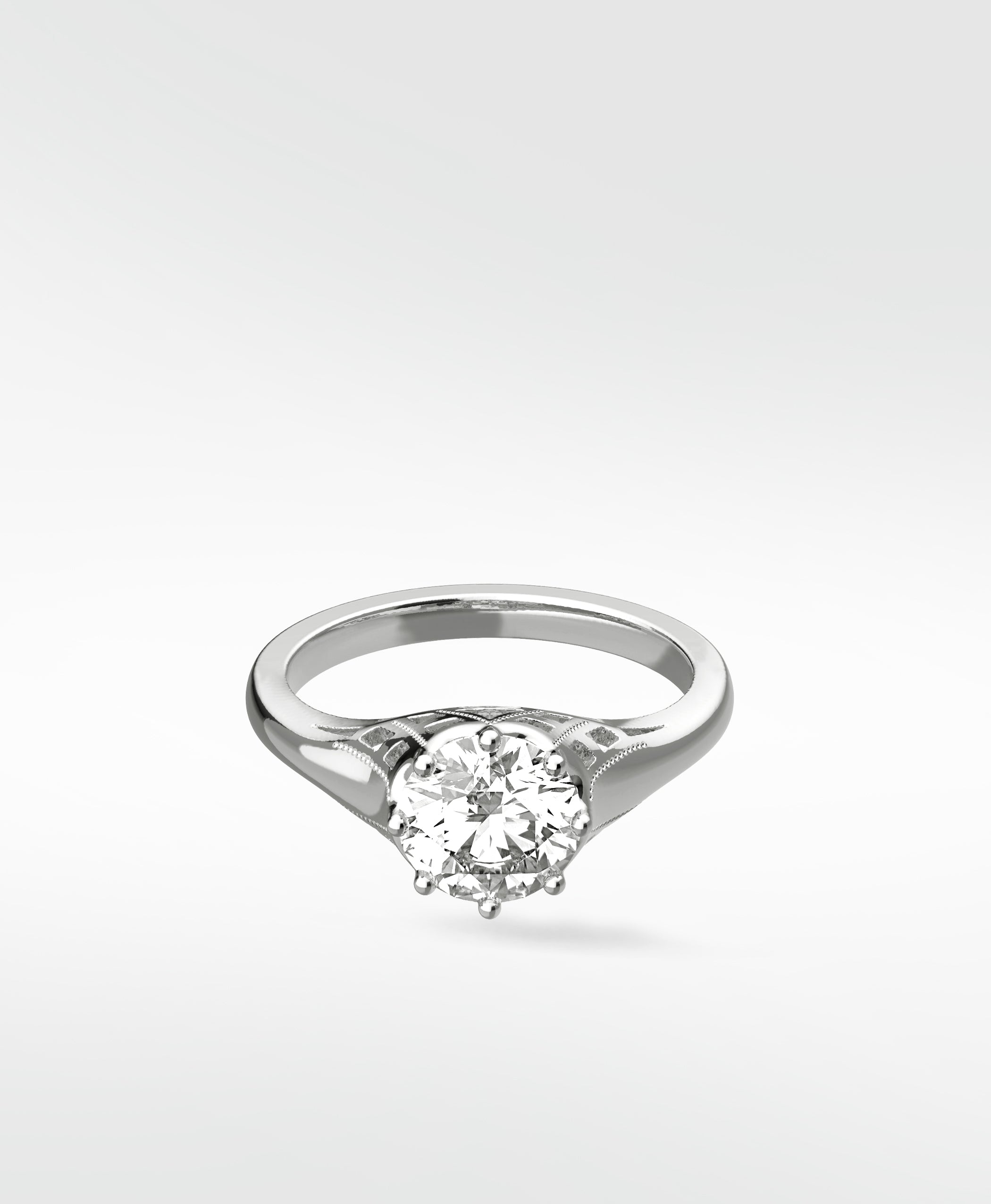 A vintage-style Mondo Engagement Ring in white gold, featuring a round brilliant diamond in a six-prong setting.