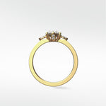 Side profile of the Fern Engagement Ring in yellow gold, featuring an oval diamond with marquise and round accent stones.
