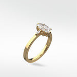 The Lark & Berry Fern Engagement Ring in yellow gold, featuring a marquise-cut center diamond and two side accent diamonds.