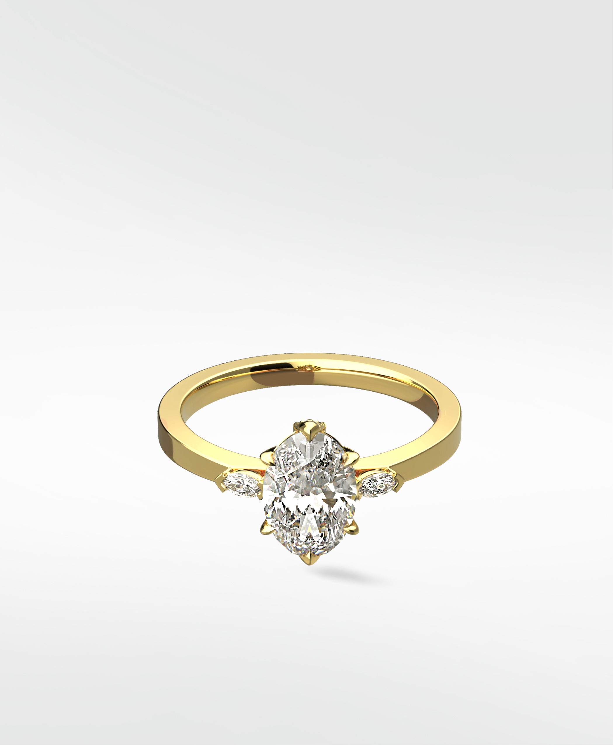Lark & Berry's Fern Engagement Ring in yellow gold, featuring a central oval diamond with marquise accent diamonds on the side.