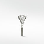 Side profile of the Torreya Diamond Engagement Ring in platinum, showcasing its twisting pavé diamond band.