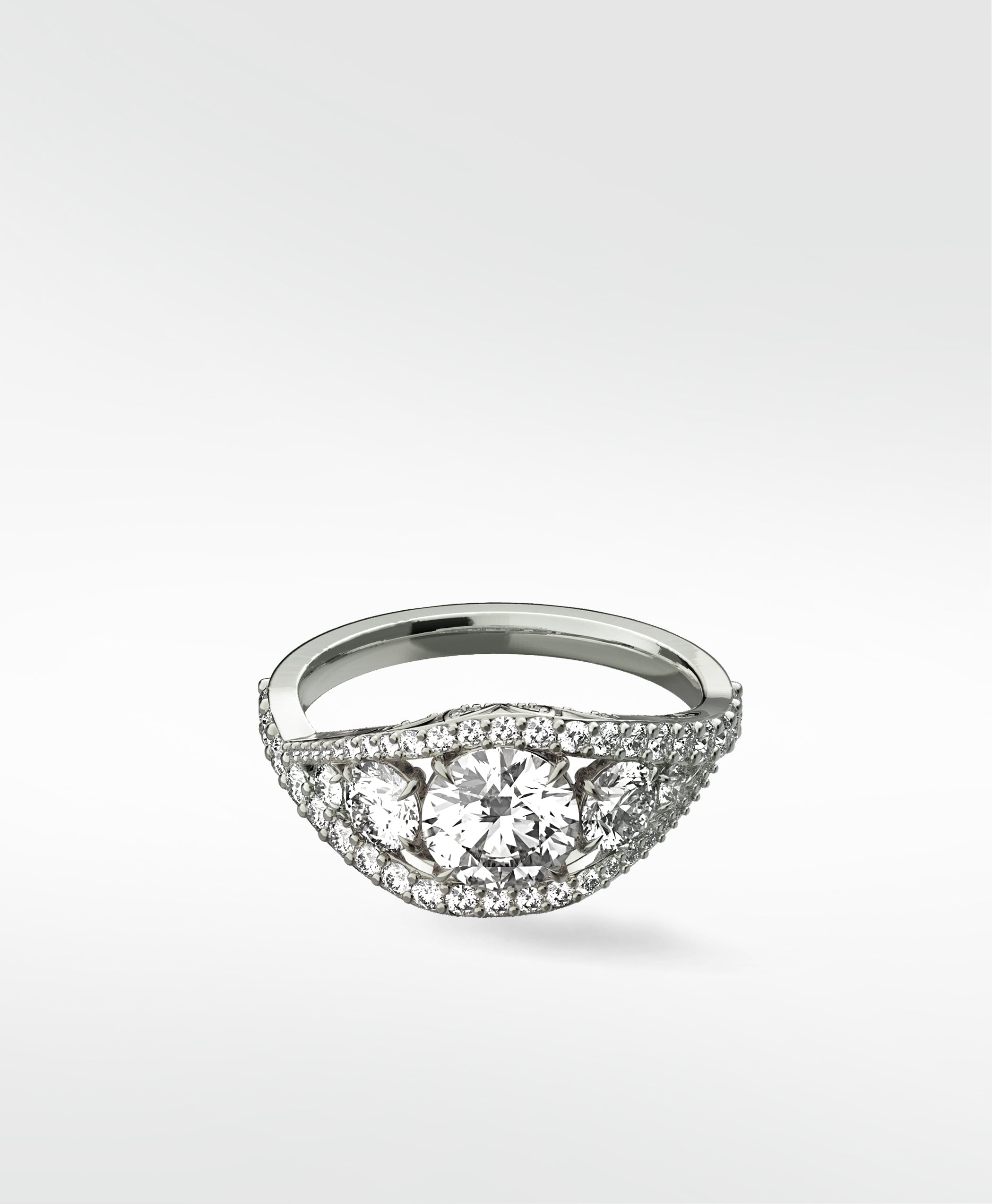 The Torreya Diamond Engagement Ring in platinum, featuring a three-stone design with a pavé diamond band.