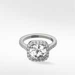 The platinum Sequoia Diamond Engagement Ring featuring a brilliant center diamond in a classic pavé halo setting.
