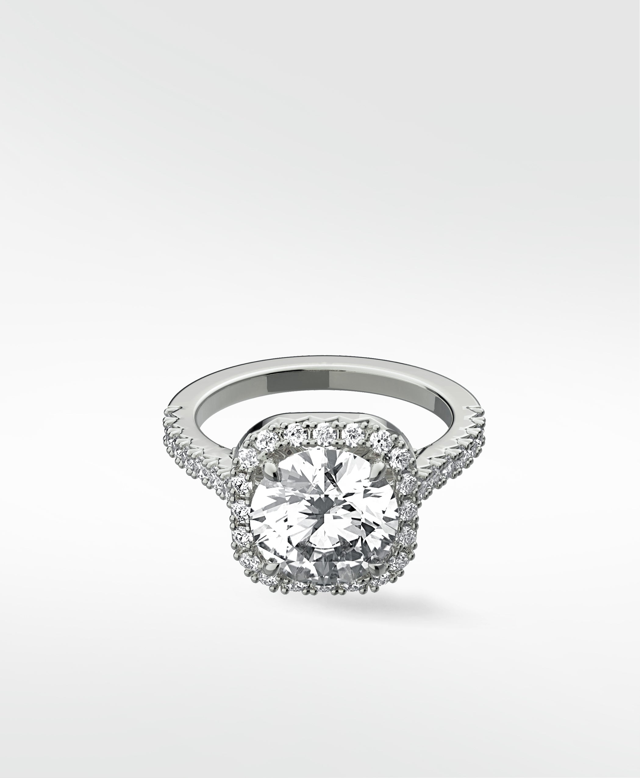 The platinum Sequoia Diamond Engagement Ring featuring a brilliant center diamond in a classic pavé halo setting.