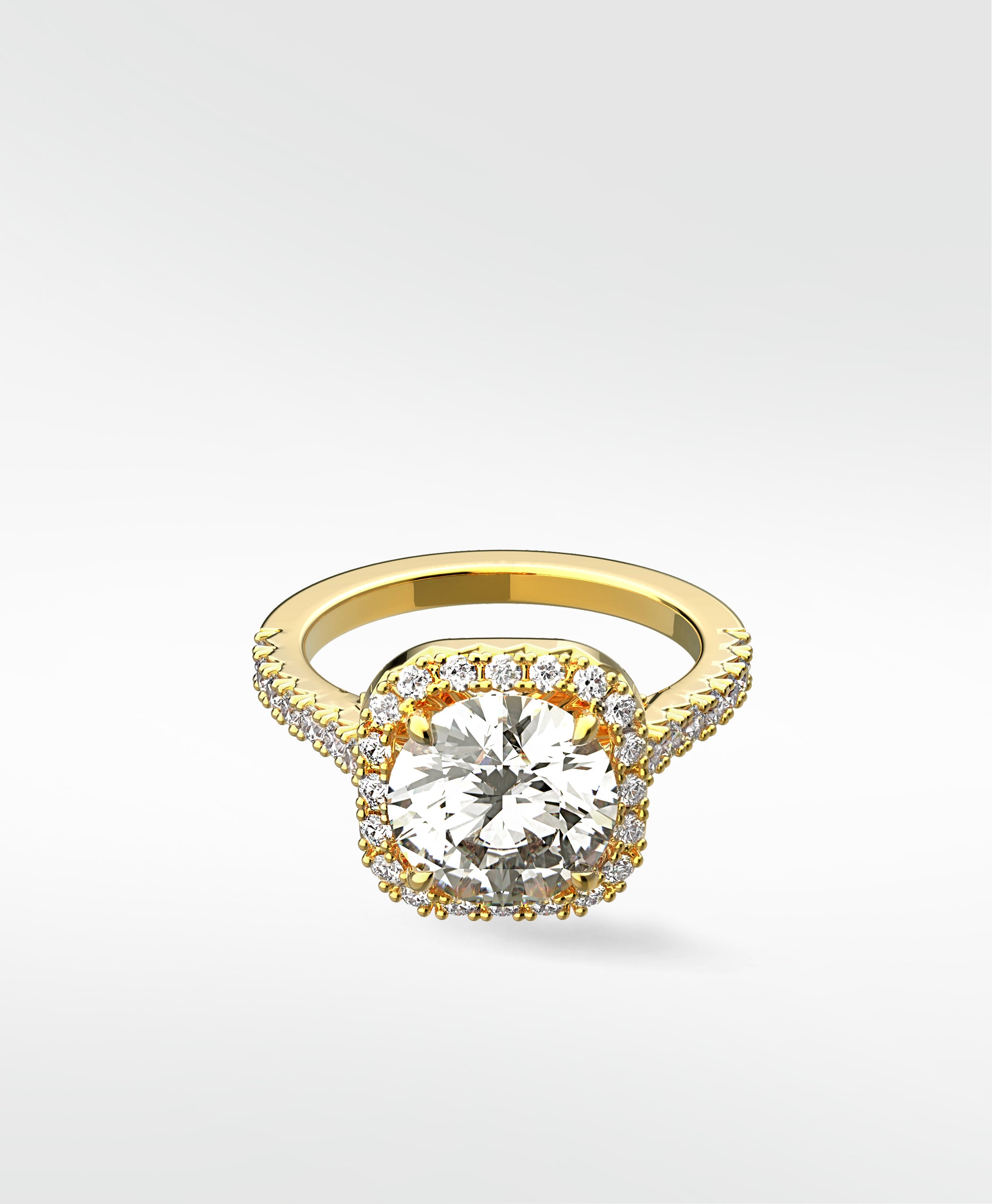 The Sequoia Diamond Engagement Ring in yellow gold, with a round diamond in a cushion halo and pavé band.
