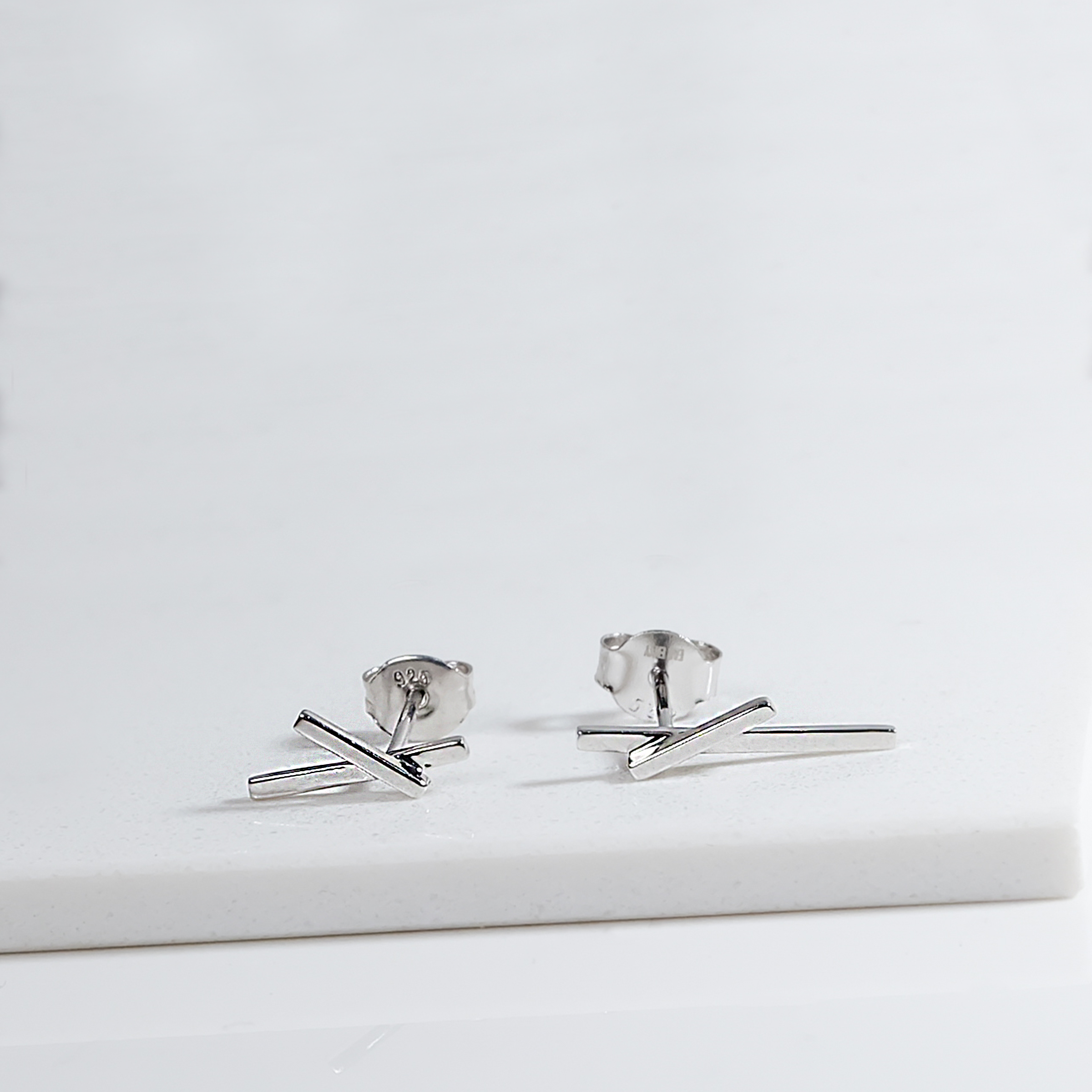 Sleek Silver Cross Earrings